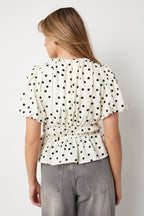 Peplum top met stippen